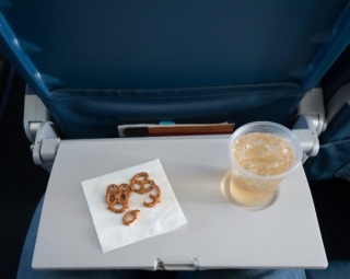 Flight Attendant Reveals What You Should Never Drink On An Airplane